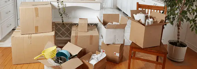 Packed moving boxes and household items in a kitchen before move-out or move-in cleaning, Tempe, AZ.